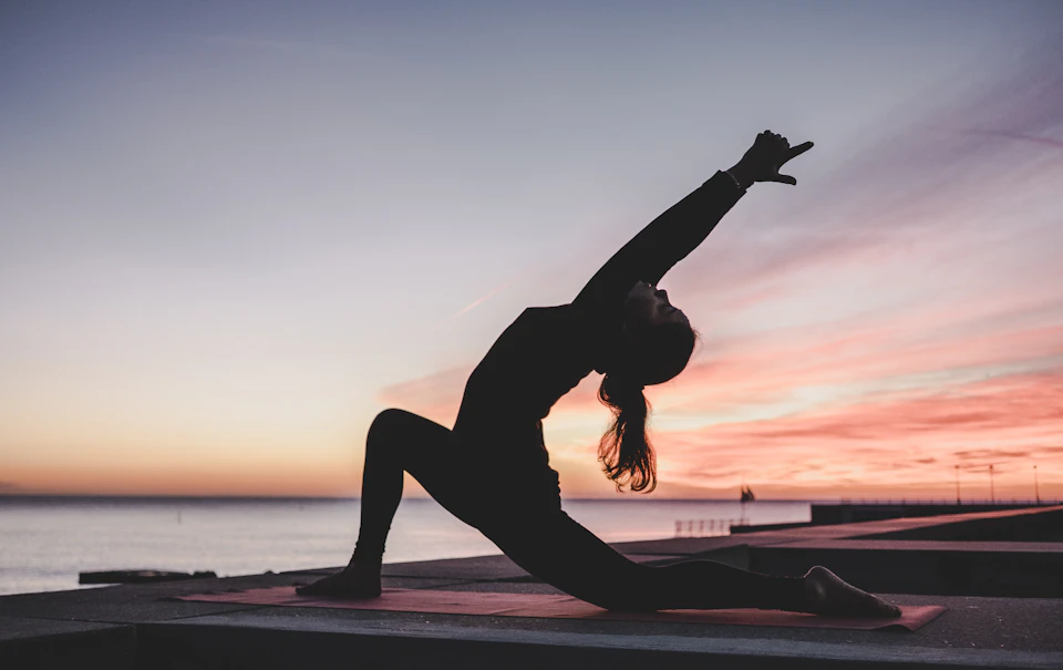 Preventive wellness session with guided yoga in a calm garden setting